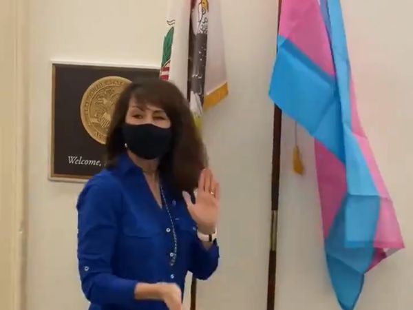 Watch: Pro-Equality Rep. Flies Trans Flag - Right Next to QAnon-Spouting Marjorie Taylor Greene's Office