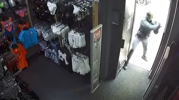 Watch: Masked Motorbikers Target Gayborhood Sex Shop with Crowbar Attack